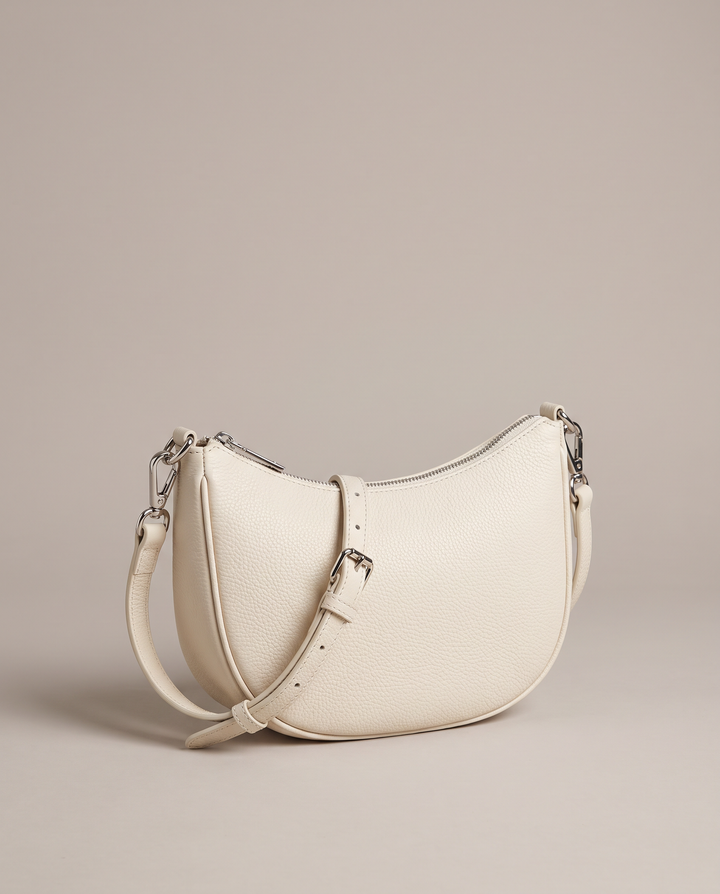 The Beaches Crossbody in ivory pebbled vegan leather with silver-tone hardware
