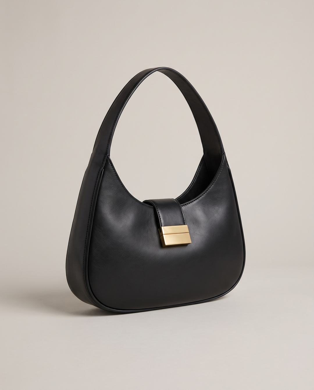 The Yorkville Shoulder Bag in black smooth vegan leather with polished gold-tone hardware