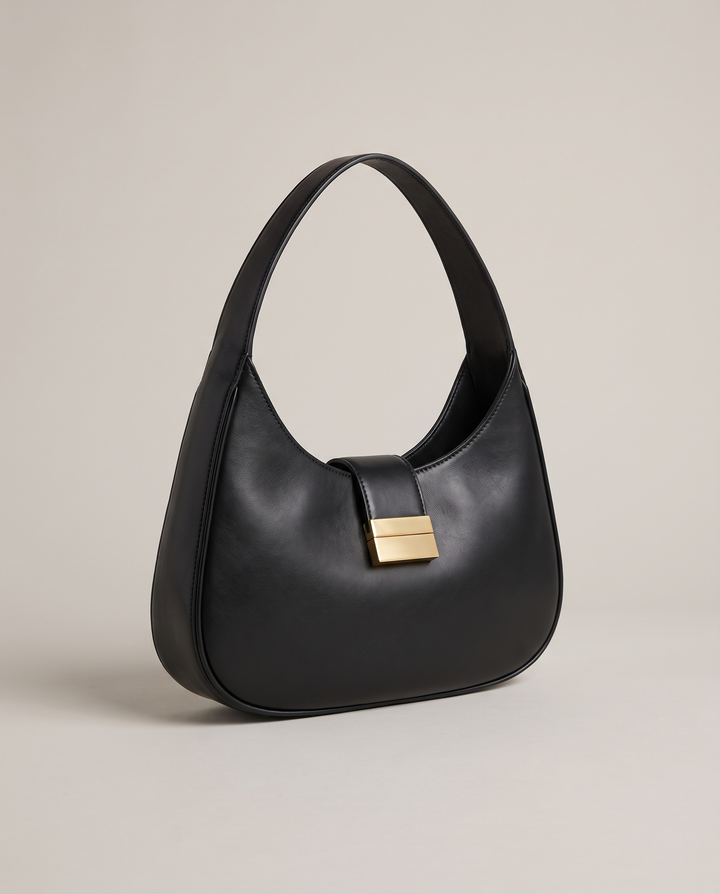 The Yorkville Shoulder Bag in black smooth vegan leather with polished gold-tone hardware